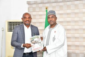 Chairman/Chief Executive of the National Drug Law Enforcement Agency, NDLEA, Brig. Gen. Mohamed Buba Marwa (Retd) presenting a copy of the Agency's magazine to the National President of Actors Guild of Nigeria, AGN, Mr. Emeka Rollas Ejezie during a visit by AGN leaders to the national headquarters of NDLEA in Abuja on Monday 7th,February,  2022
