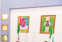 Reactions as Bola Ahmed Tinubu’s presidential portrait was spotted hanging behind Atiku Abubakar.