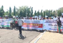 Resign Now, Massive Crowd Tells Wike As Protesters Storm National Assembly