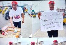Human Rights Activist stages a one-man protest to challenge the government’s nonchalance over the plight of Nigerians.
