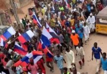 Police arrests foreigner, 76 Nigerians with Russian flag during #EndBadGovernance protest in Kano